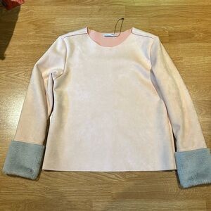 Pale pink ultra suede top with grey faux fur trimmed sleeve